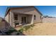 Backyard features a covered patio, a grill, and a block fence at 47859 W Moeller Rd, Maricopa, AZ 85139