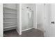 Bathroom showing a shower with glass doors and built-in shelving at 47859 W Moeller Rd, Maricopa, AZ 85139