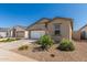 Beautiful desert home with drought-tolerant landscaping, a two-car garage, and light-colored stucco at 47859 W Moeller Rd, Maricopa, AZ 85139