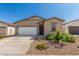 Charming single-story home featuring low-maintenance landscaping, a two-car garage, and a welcoming front entrance at 47859 W Moeller Rd, Maricopa, AZ 85139