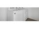 Laundry room with a white Whirlpool washer and dryer, and hard flooring at 47859 W Moeller Rd, Maricopa, AZ 85139