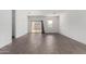 Inviting living space with modern wood-look tile flooring, a sliding glass door, and a bright, open feel at 47859 W Moeller Rd, Maricopa, AZ 85139