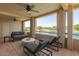 Cozy balcony with seating area offering stunning golf course and lake views at 5102 N 31St Pl # 436, Phoenix, AZ 85016