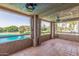 Spacious balcony with tiled floors and scenic views of the golf course and lake at 5102 N 31St Pl # 436, Phoenix, AZ 85016