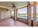A covered patio provides tranquil outdoor scenery, showcasing the lush golf course and serene lake at 5102 N 31St Pl # 436, Phoenix, AZ 85016