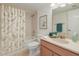 Bathroom boasts a shower-tub combo with nature-themed curtain and neutral vanity at 5102 N 31St Pl # 436, Phoenix, AZ 85016