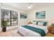 Bedroom features a large window, ceiling fan, tile floor, and light decor at 5102 N 31St Pl # 436, Phoenix, AZ 85016