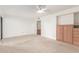 Spacious bedroom boasts carpet flooring, ceiling fan, and attached bath access at 5102 N 31St Pl # 436, Phoenix, AZ 85016
