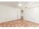 Empty bedroom boasts tile flooring, closet, ceiling fan and neutral paint at 5102 N 31St Pl # 436, Phoenix, AZ 85016