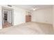 This bedroom has a ceiling fan, neutral carpet, and kitchen access at 5102 N 31St Pl # 436, Phoenix, AZ 85016