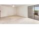 Bright bedroom features sliding glass door, ceiling fan and neutral carpet at 5102 N 31St Pl # 436, Phoenix, AZ 85016