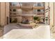 Condo courtyard with water feature and desert landscaping, surrounded by residential buildings at 5102 N 31St Pl # 436, Phoenix, AZ 85016