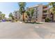 Multi-story condo building exterior featuring beautiful green landscaping at 5102 N 31St Pl # 436, Phoenix, AZ 85016