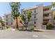Close-up view of condo building featuring balcony and desert landscaping at 5102 N 31St Pl # 436, Phoenix, AZ 85016