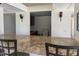 Kitchen with tile counters and bar seating overlooking the other rooms of the home at 5102 N 31St Pl # 436, Phoenix, AZ 85016