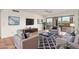 Comfortable living room featuring plush seating, tile floors, and sliding glass doors to a balcony at 5102 N 31St Pl # 436, Phoenix, AZ 85016