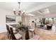 Open-concept living and dining room area with tile floors, chandelier, and comfortable seating at 5102 N 31St Pl # 436, Phoenix, AZ 85016