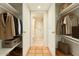 Well organized walk-in closet leads to an accessible bathroom and shower at 5102 N 31St Pl # 436, Phoenix, AZ 85016