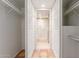 This walk-in closet leads to a bathroom with tiled floors and shower at 5102 N 31St Pl # 436, Phoenix, AZ 85016