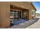 Covered back patio area with stylish outdoor furniture at 531 S 198Th Ave, Buckeye, AZ 85326