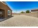 Spacious, low-maintenance backyard with gravel landscaping and block wall fencing providing privacy at 531 S 198Th Ave, Buckeye, AZ 85326