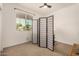 Bright bedroom with a privacy screen and window views at 531 S 198Th Ave, Buckeye, AZ 85326