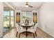 Bright breakfast nook features a round dining table and sliding door to the backyard at 531 S 198Th Ave, Buckeye, AZ 85326