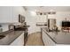 Well-equipped kitchen with island, stainless appliances, modern cabinets, and gray countertops at 531 S 198Th Ave, Buckeye, AZ 85326