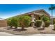 Corner lot view showcasing a single-story home with desert landscaping and a two-car garage on a clear day at 531 S 198Th Ave, Buckeye, AZ 85326
