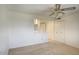 Cozy bedroom featuring plush carpet, closet, and a view to the bath at 5807 W Acoma Dr, Glendale, AZ 85306
