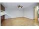Open-concept dining area with laminate floors and a modern ceiling fan at 5807 W Acoma Dr, Glendale, AZ 85306