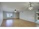 Spacious living room showcasing wood floors, natural light, and contemporary ceiling fans at 5807 W Acoma Dr, Glendale, AZ 85306
