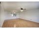 Bright living room with wood floors and ceiling fan, offering ample space at 5807 W Acoma Dr, Glendale, AZ 85306