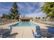 Community pool area with comfortable seating and a view of the surrounding complex at 5807 W Acoma Dr, Glendale, AZ 85306