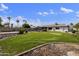 Large backyard with well-maintained lawn, mature trees, and landscaping, offering ample space for recreation at 6027 E Spring Rd, Scottsdale, AZ 85254
