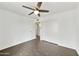 Bedroom boasts sleek flooring, ceiling fan, and closet, offering ample storage space and modern appeal at 6027 E Spring Rd, Scottsdale, AZ 85254