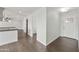 Inviting entryway and hallway with wood-look floors lead to kitchen at 6027 E Spring Rd, Scottsdale, AZ 85254