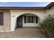 Close up of the front entrance with brick archway and pathway at 6027 E Spring Rd, Scottsdale, AZ 85254