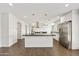 Modern kitchen features a large island, stainless steel appliances, and ample cabinet space at 6027 E Spring Rd, Scottsdale, AZ 85254