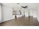 Spacious living area boasting wood floors, neutral walls, recessed lighting, and seamless flow into the modern kitchen at 6027 E Spring Rd, Scottsdale, AZ 85254