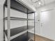 Pantry features ample metal shelving and easy access to storage space at 6027 E Spring Rd, Scottsdale, AZ 85254