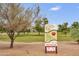 Kierland Park entrance sign with park rules, hours, and COVID-19 information for a community park visit at 6027 E Spring Rd, Scottsdale, AZ 85254