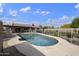 Fenced pool and outdoor living area with a covered patio, ideal for leisure and recreation at 6027 E Spring Rd, Scottsdale, AZ 85254