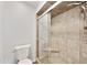 Stylish shower featuring neutral tile, built-in seat, and a modern showerhead at 6027 E Spring Rd, Scottsdale, AZ 85254