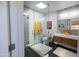 Modern bathroom featuring a glass shower, floating vanity, and stylish decorative tiles at 712 W Vernon Ave, Phoenix, AZ 85007
