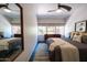 Charming bedroom featuring a ceiling fan, neutral decor, modern furniture, and natural light at 712 W Vernon Ave, Phoenix, AZ 85007