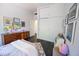 Bright bedroom featuring modern decor, storage, plush bedding, and built-in storage at 712 W Vernon Ave, Phoenix, AZ 85007