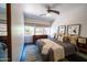 Bedroom featuring a ceiling fan, neutral decor, modern furniture, and natural light at 712 W Vernon Ave, Phoenix, AZ 85007