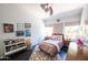 Cozy bedroom featuring playful decor, colorful artwork, and comfortable furnishings at 712 W Vernon Ave, Phoenix, AZ 85007