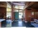 Stunning entryway with brick walls, skylight, and slate floors that leads into a well-lit dining area at 712 W Vernon Ave, Phoenix, AZ 85007